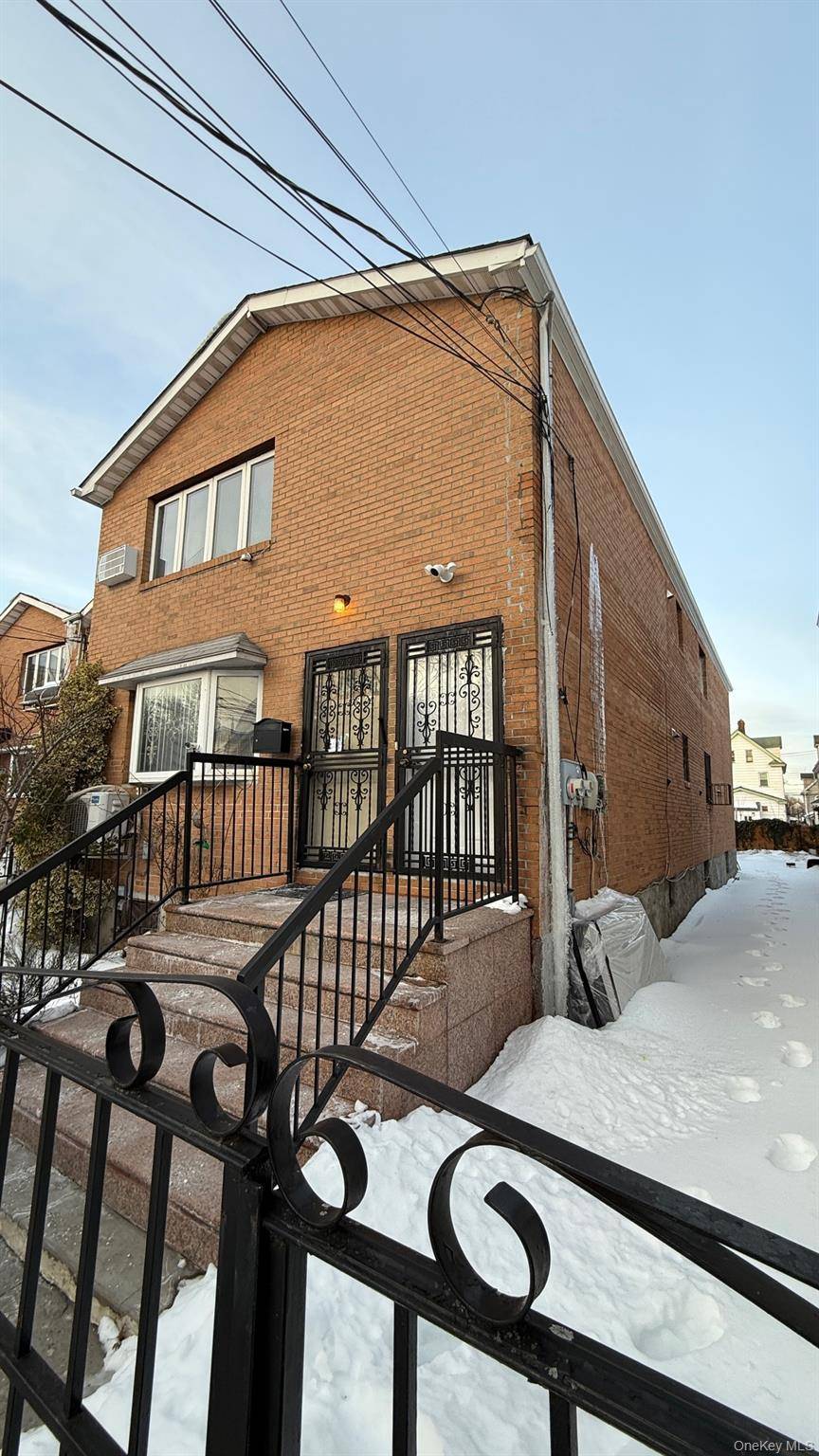 A 2 family brick residence, constructed in 2002, boasts a total living area of 2450 square feet.