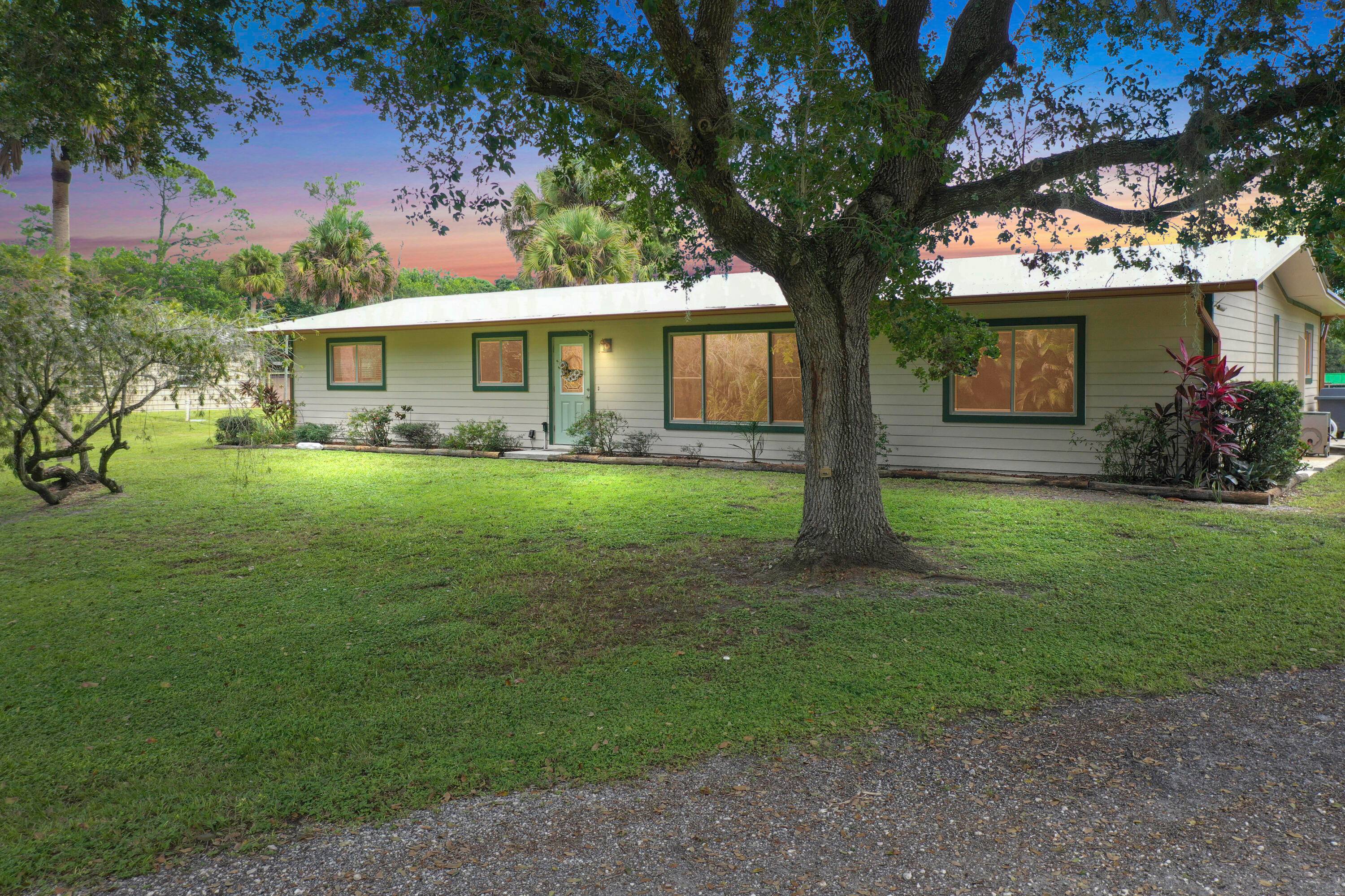 Price Improvement Motivated Seller Prime location for this beautiful updated 3 bed 3 bath pool home on 5 acres in Palm City Farms.