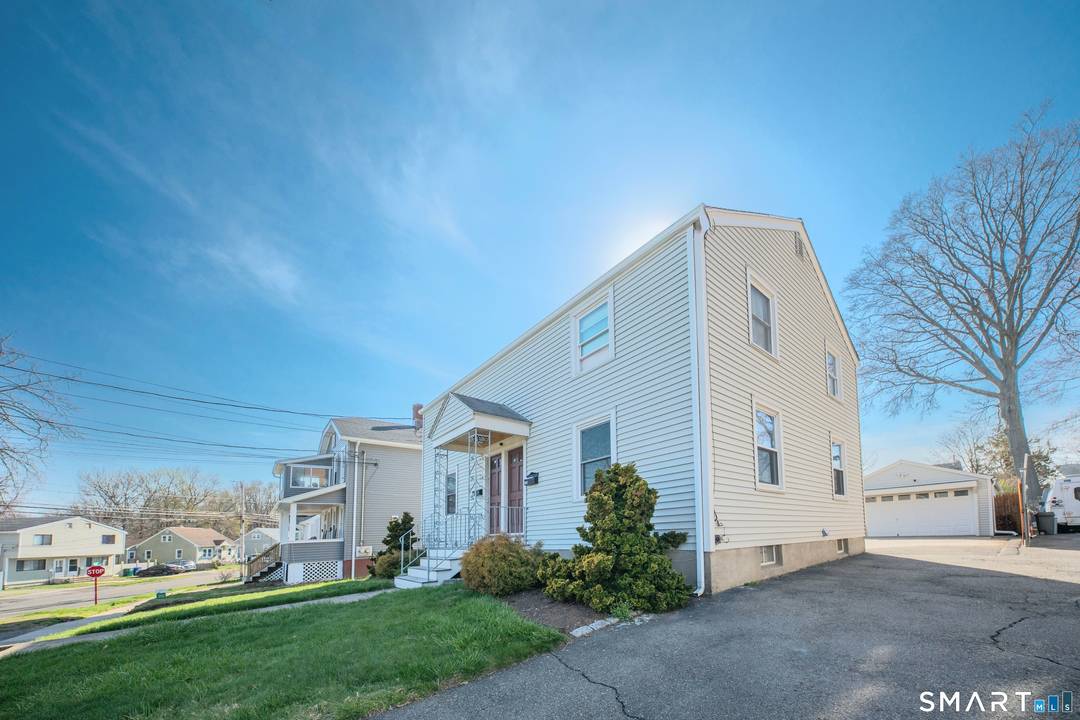 Beautifully maintained 2 Family, Side by Side Townhouse Style Duplex offering the perfect blend of comfort, style, and functionality, featuring a newer roof and vinyl siding, along with an extra ...