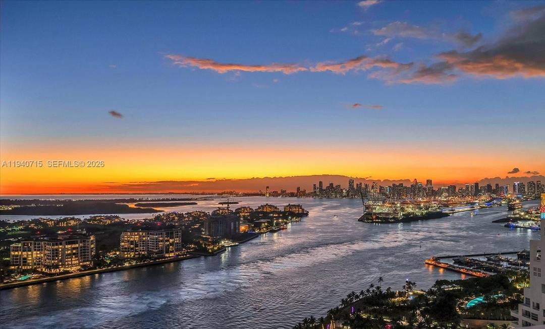 The Other Side... One of kind luxury custom unit on the 30th floor South Tower offering sweeping wide bay sunset views of downtown Miami skyline.