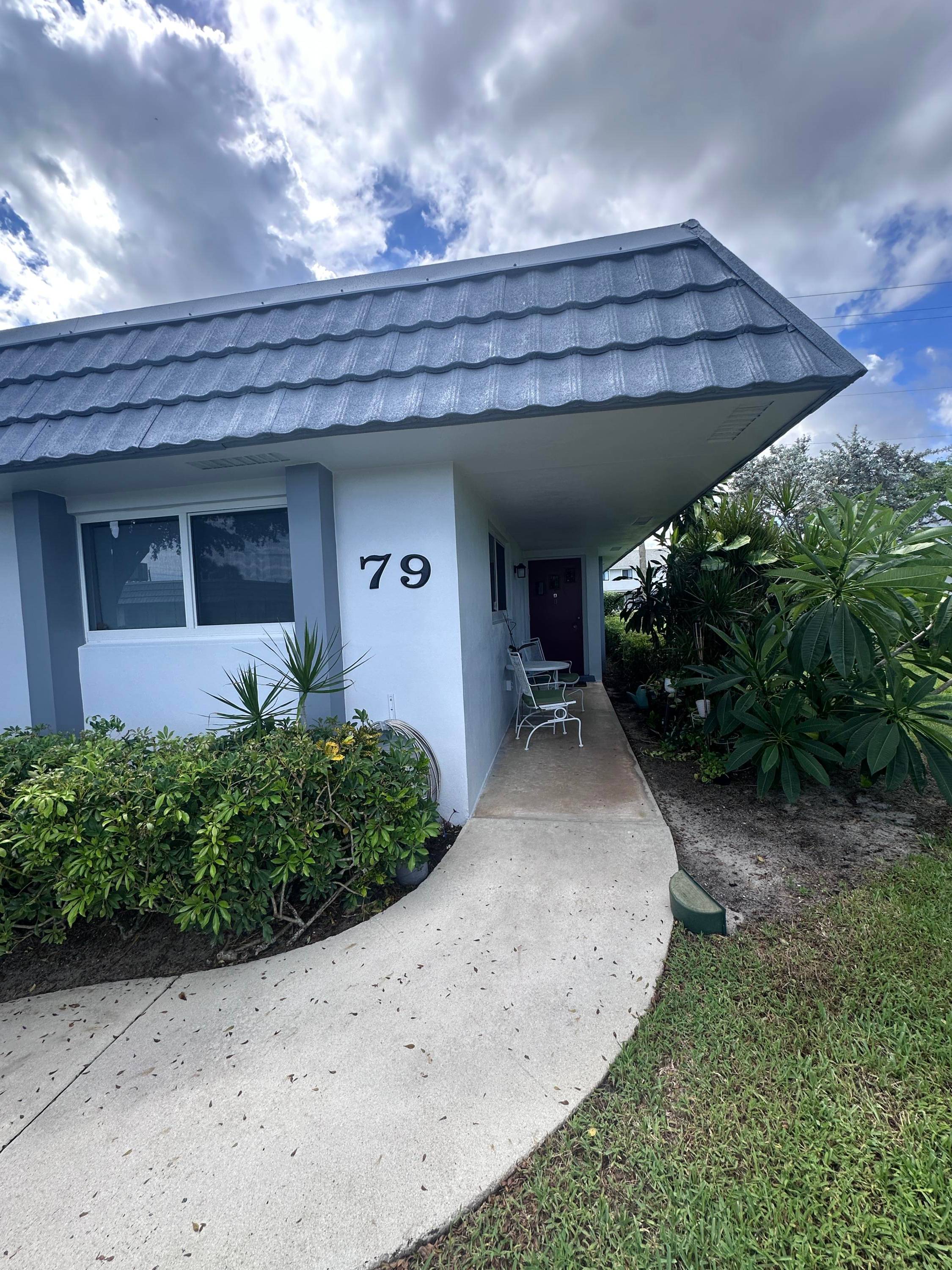 55 corner condo in Cresthaven with 2 bedrooms, 2 full baths, and a private backyard overlooking the canal.