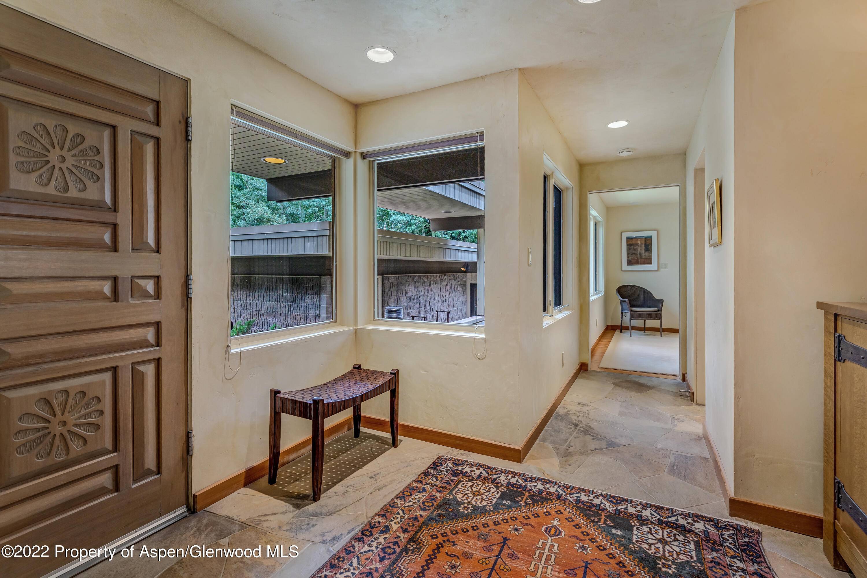 Timeless design and single level living on an exceptional lot in West Aspen, with ski access to and from Aspen Highlands.