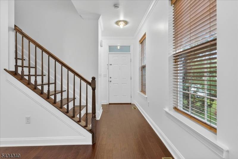 Rare end unit townhome in Montgomery Ridge one of Montgomery Township's most sought after communities offering 3 bedrooms, 3 full baths, and a powder room across three fully finished levels.