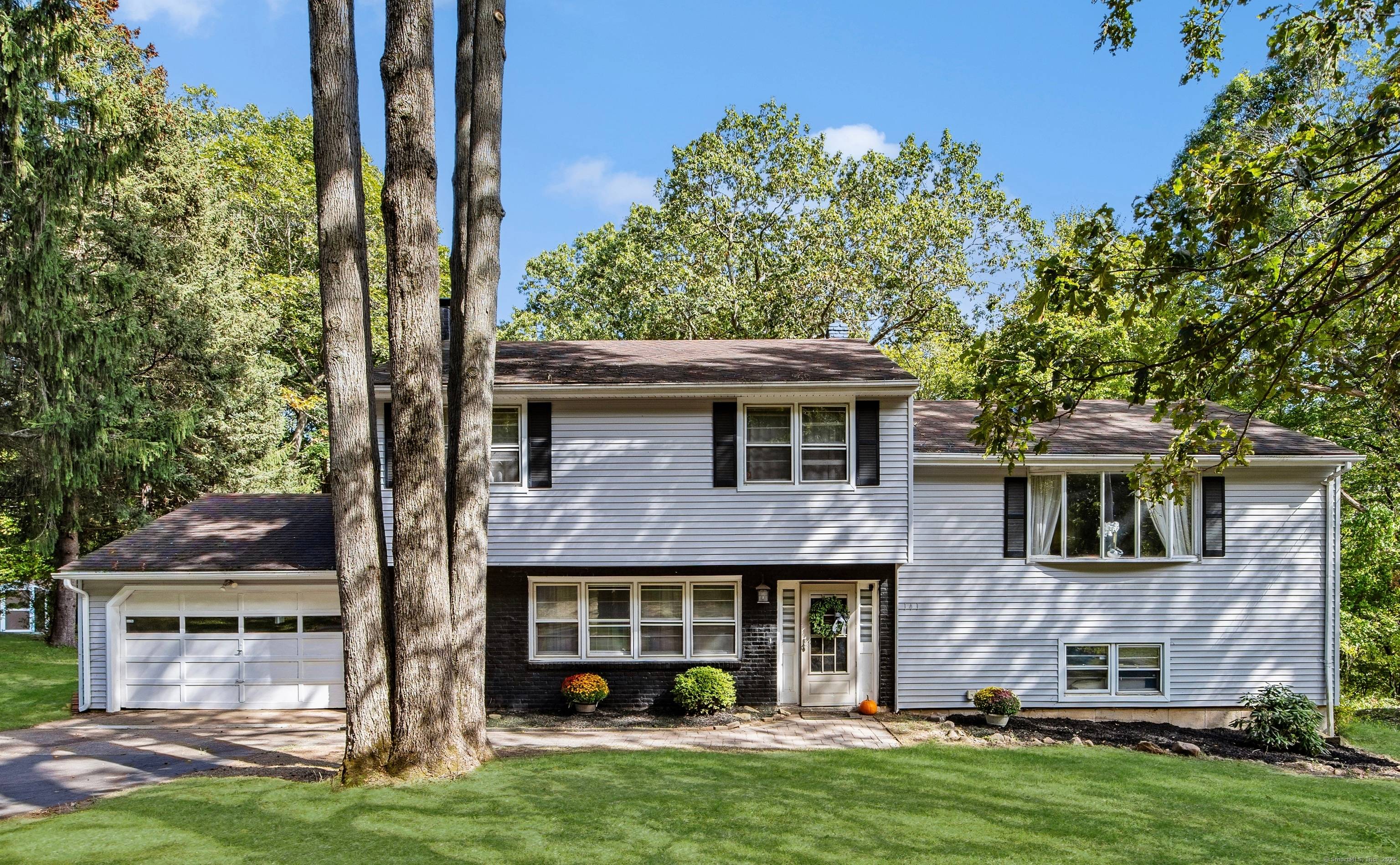 Located in the sought after Mount Carmel section of Hamden, this split level home offers 4 bedrooms, 1.