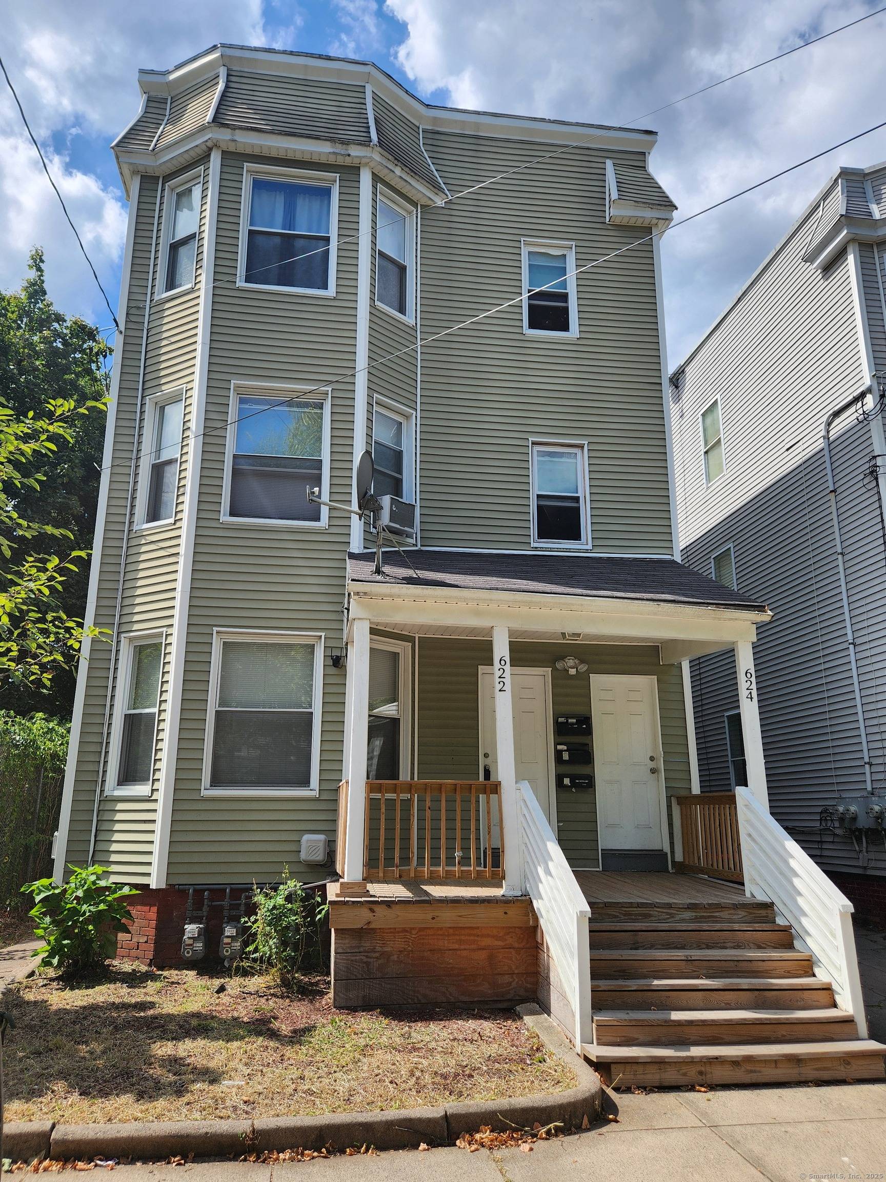 Recently renovated kitchens on the 1st and 2nd floors highlight this spacious three family property offering 3, 498 sq.