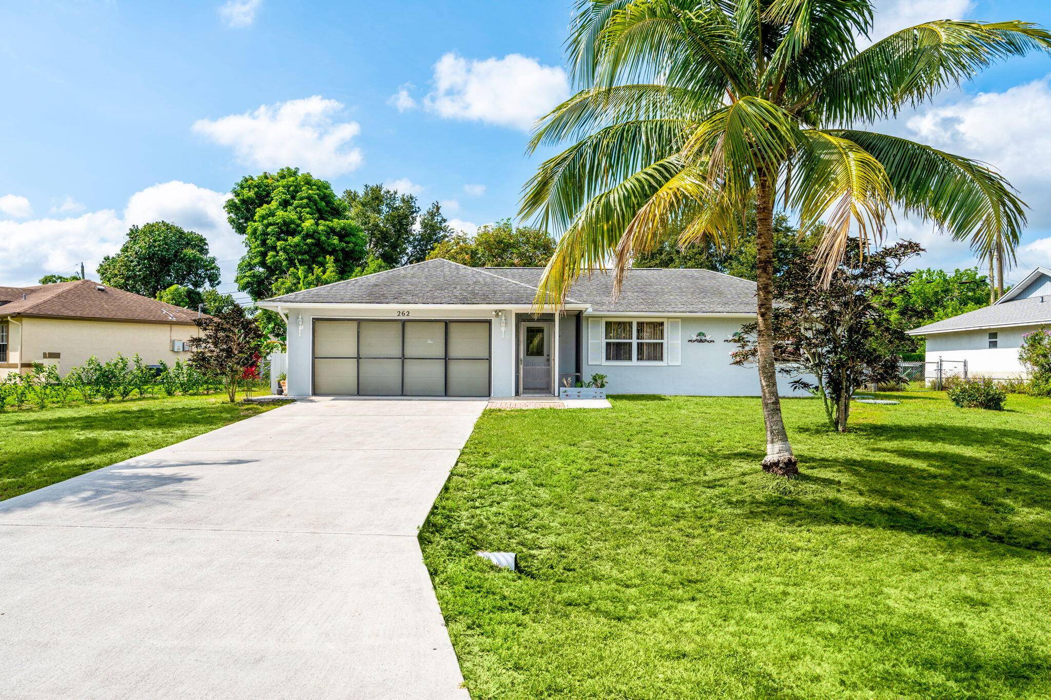 This charming 2 bedroom, 2 bath home with a 2 car garage in a non HOA community is a perfect blend of comfort and convenience in sunny Port.