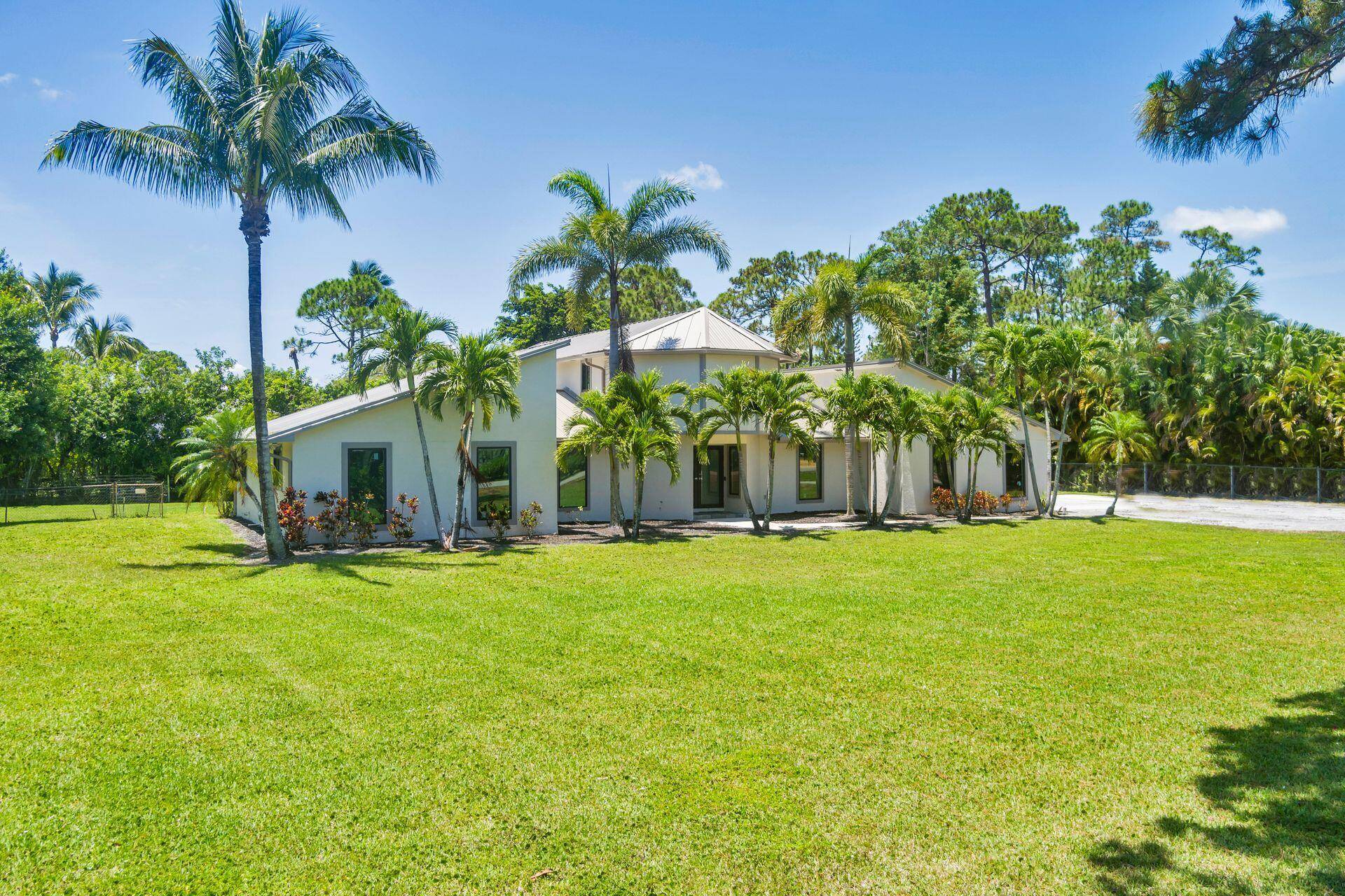 Beautiful, Palm Beach Country Estates custom home located on 1 plus acre lot featuring 3 bedrooms, 2 baths, den, 2 car garage and a separate 720 sq ft 1 BD ...