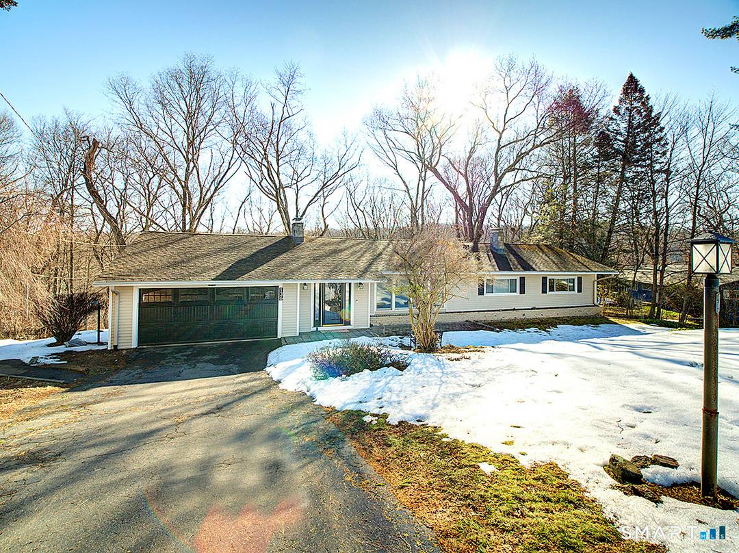 Experience refined, nature infused living in this exceptional residence overlooking the tranquil Mill River.