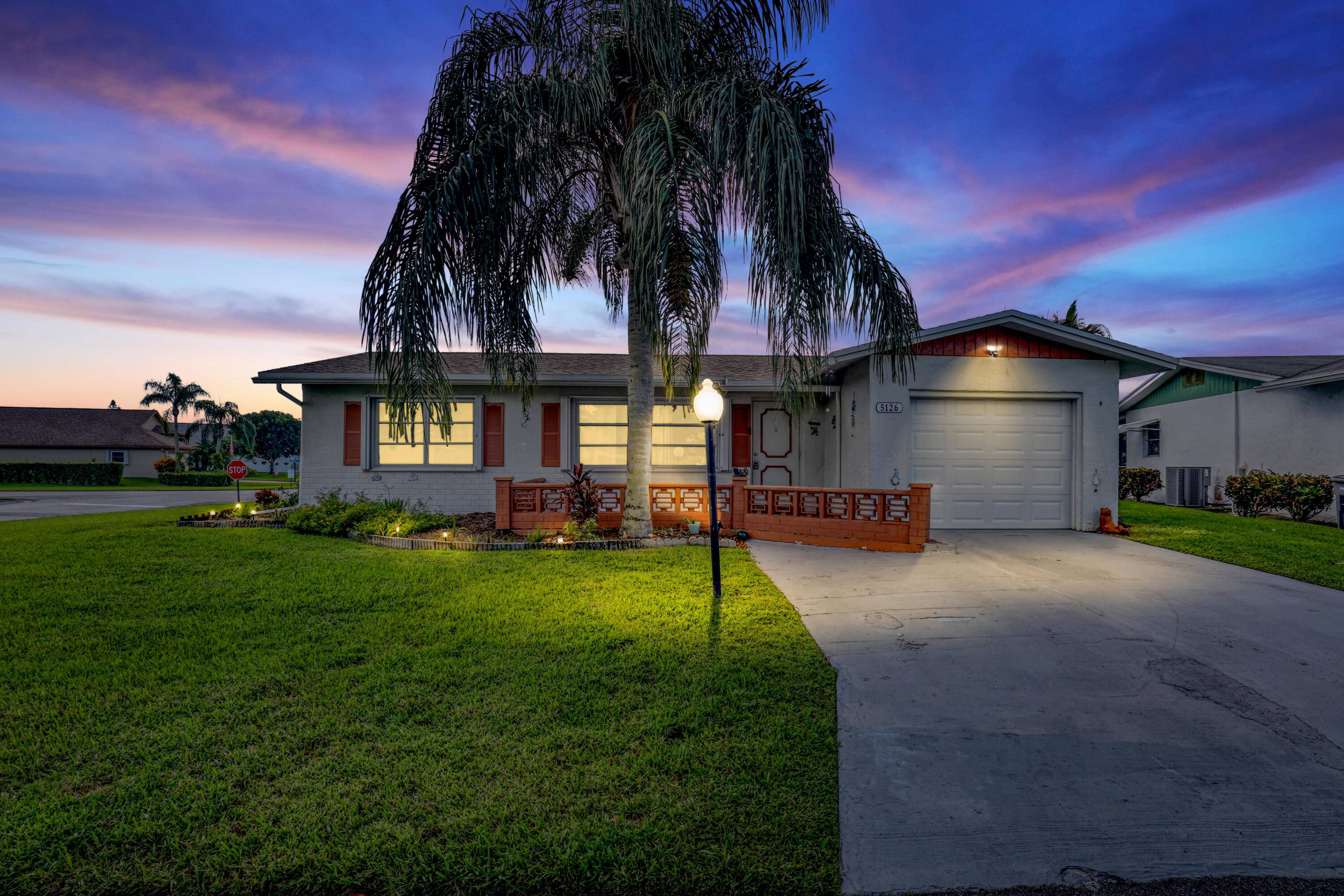 Charming 2 BR, 2 BA home with 1 car garage on a corner lot.