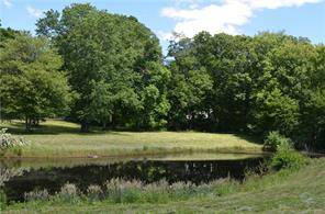 If you have been dreaming of building your home on a picturesque pond this may be the perfect property for you !