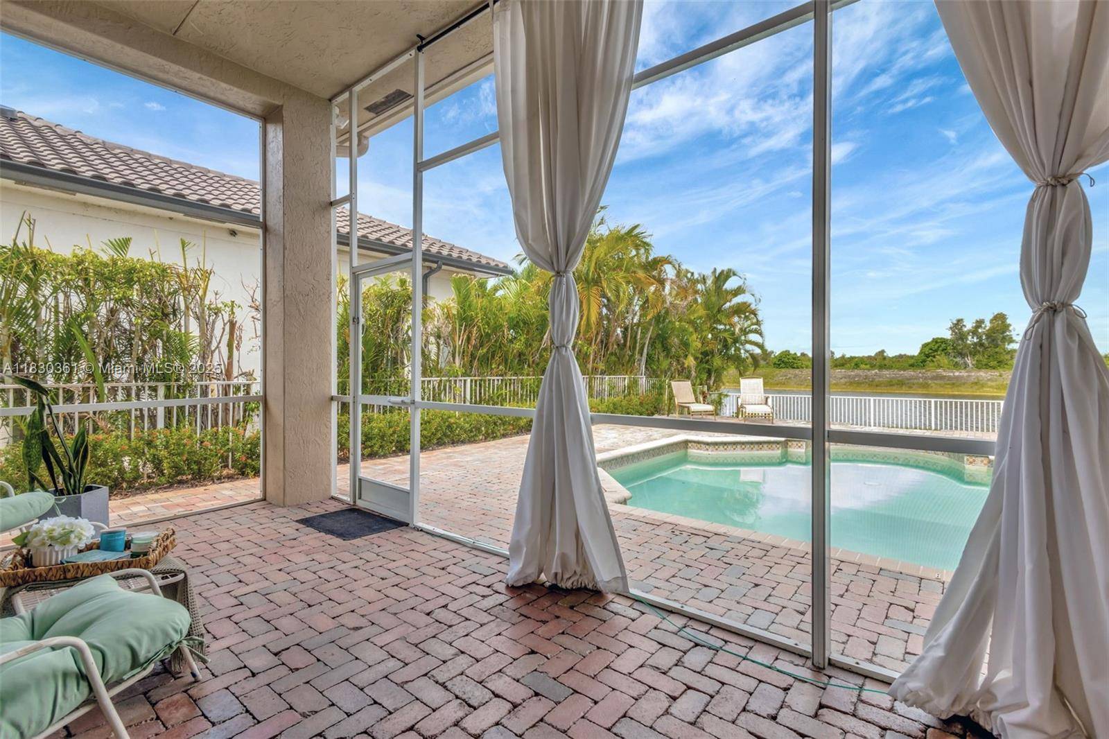 Welcome to your private waterfront retreat in the exclusive Grand Isle section of Sunset Lakes.
