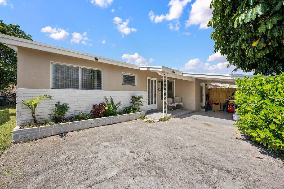 An inviting 3 bedroom, 1 bath home in Hallandale Beach featuring a functional floor plan, spacious living area, and a bright kitchen.
