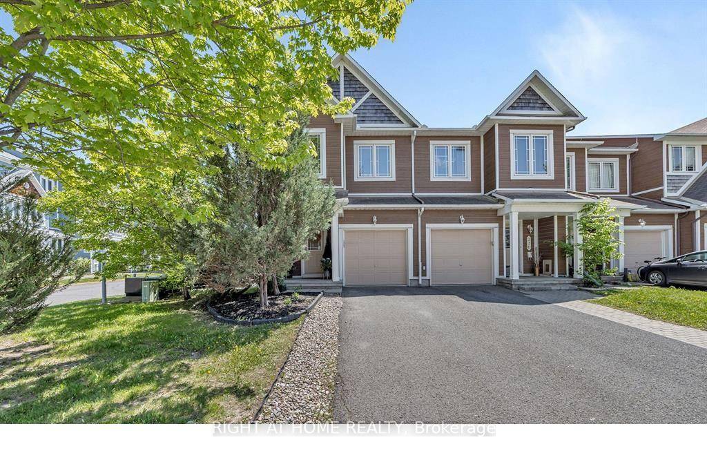 Spacious and well maintained 3 bedroom, 3 bathroom corner unit townhome in the heart of Kanatas Emerald Meadows.