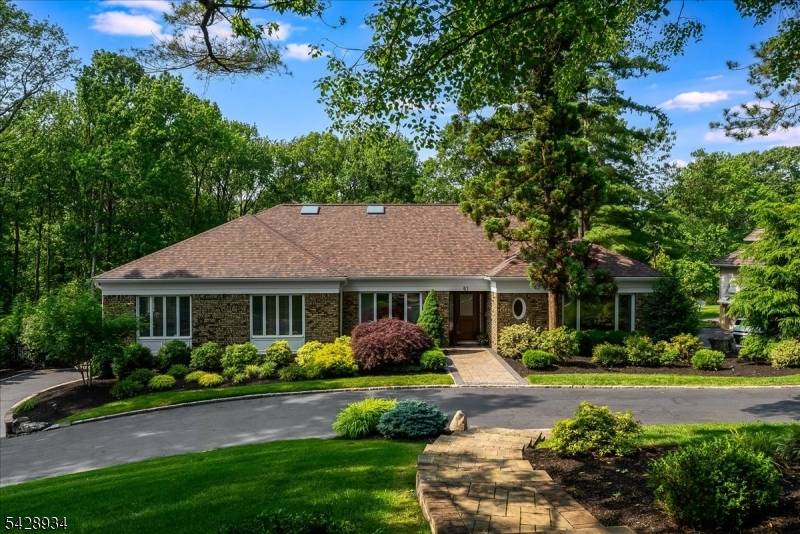 Beautifully renovated custom home in Springfield's Baltusrol Top neighborhood on a private.