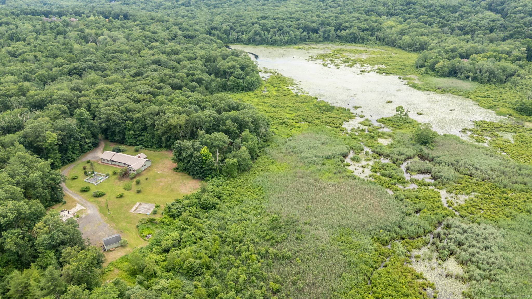 Tucked away at the end of a long, private driveway, this sprawling 2 bedroom ranch offers the ultimate in privacy and tranquility.