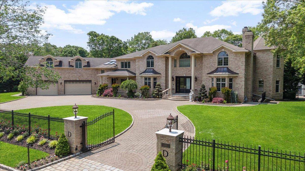 Architectural Masterpiece in the Heart of Dix Hills Tucked away at the end of a quiet cul de sac, this stately all brick estate offers the ultimate in privacy, luxury, ...