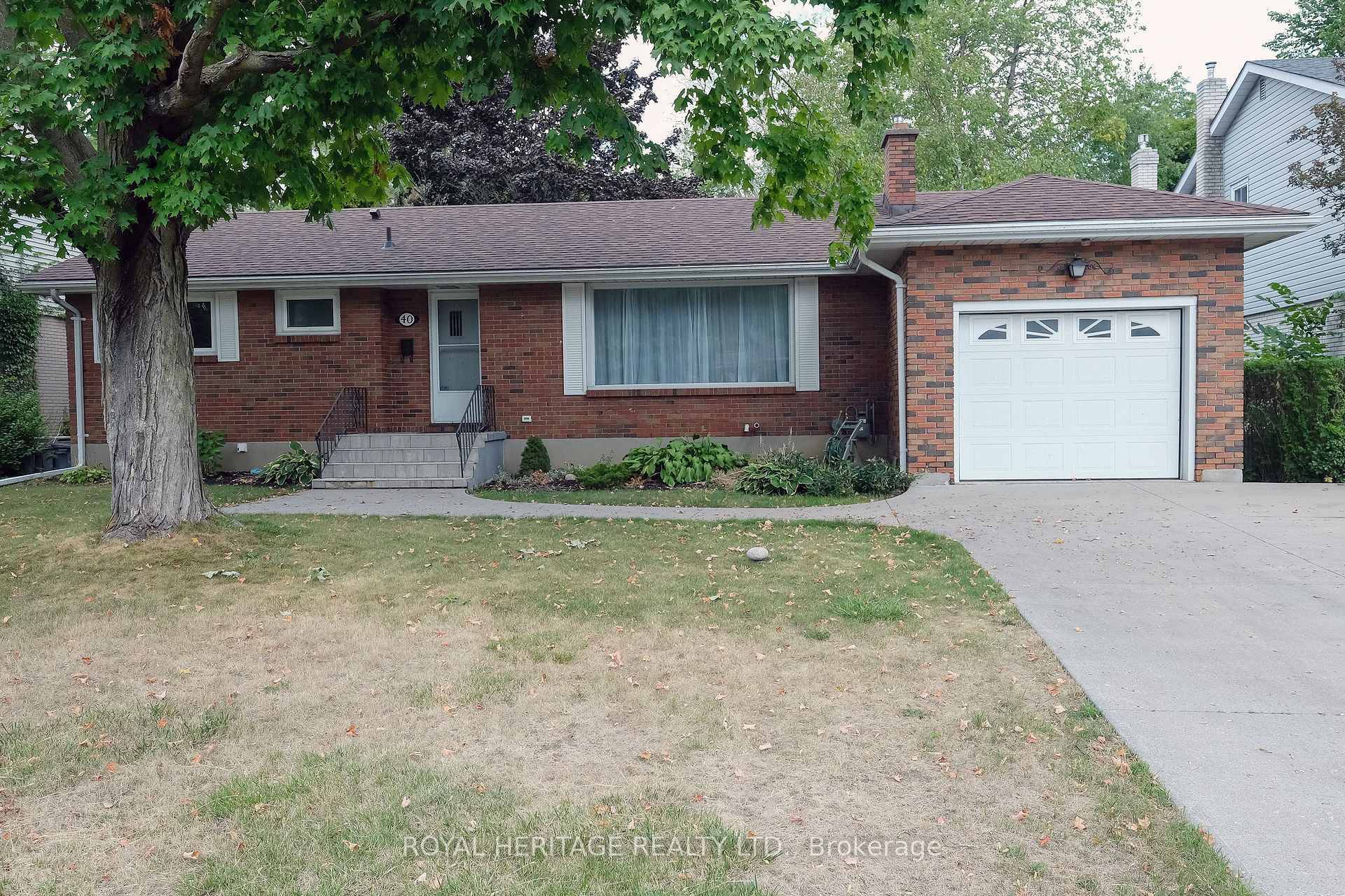 Welcome to this inviting brick bungalow in the heart of East Hill, a neighborhood known for its charm and convenience.