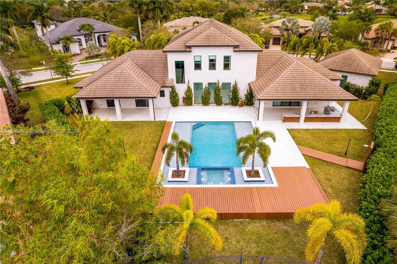 Stunning Parkland Contemporary style estate with amazing lake views is located within the prestigious Heron Estates at Heron Bay.