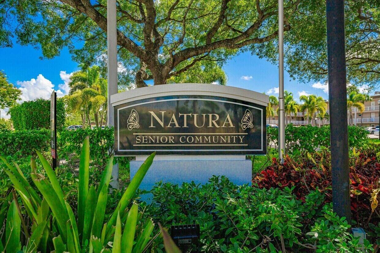 55 Community NEW ROOF ! This charming 2BR 2BA corner villa in Natura offers single level living with a bright open layout and tranquil garden views.