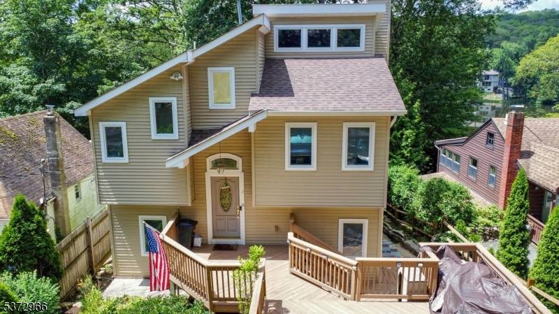 Welcome to your serene lakefront escape in sought after Fayson Lakes !