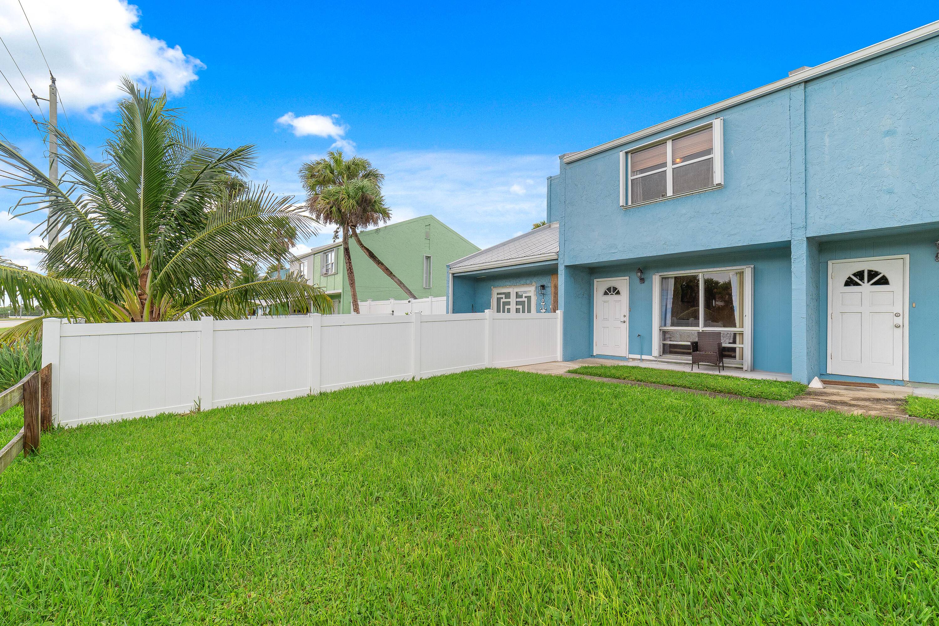 Experience the Florida beach lifestyle in this charming two story townhouse located in the Coral Cove Beach community, just a five minutes from the ocean.