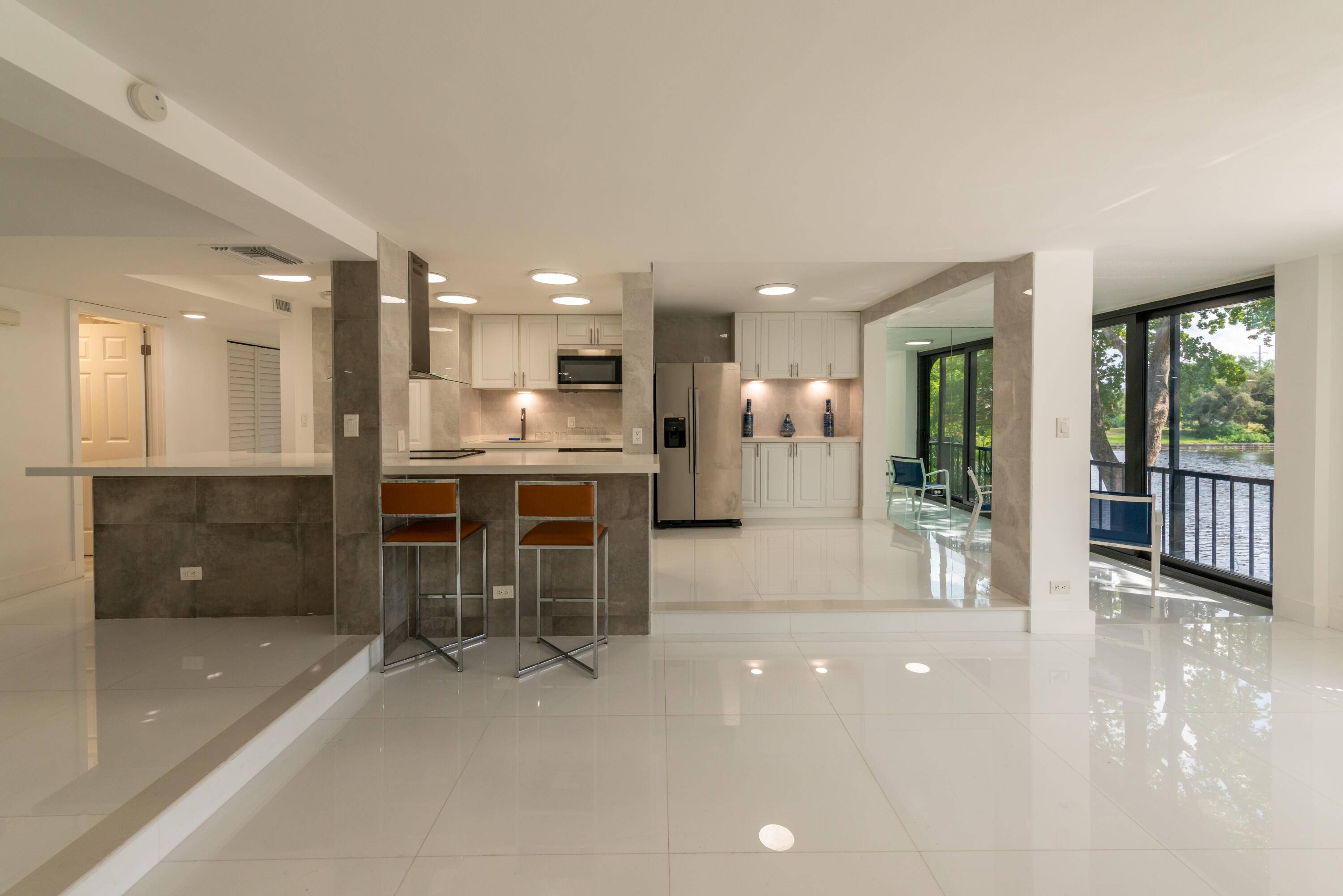 Stunningly remodeled corner unit in a coveted community with radiant water views throughout.