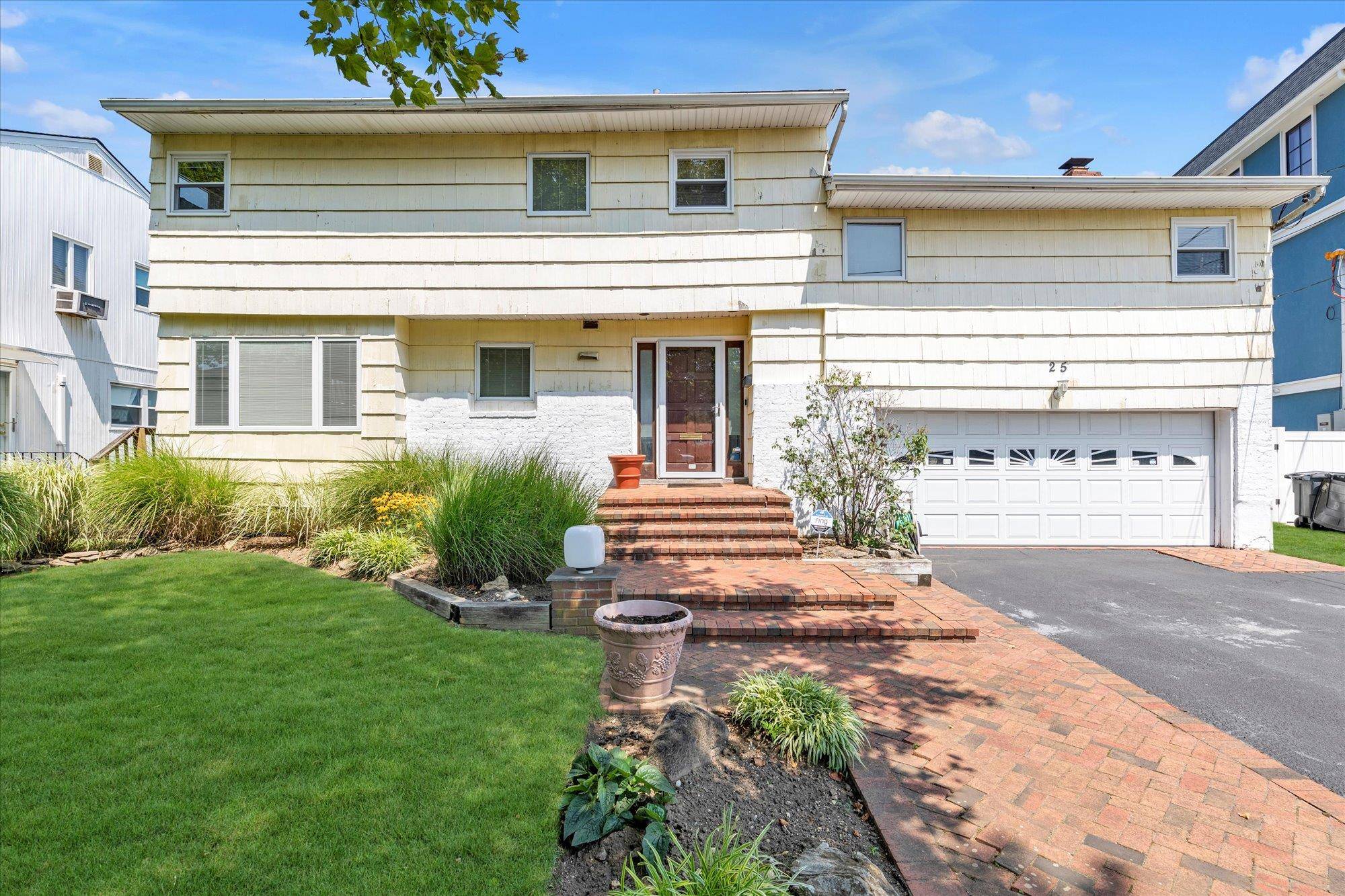 Welcome to 25 Park Circle, an open and airy home in the heart of Cedarhurst.