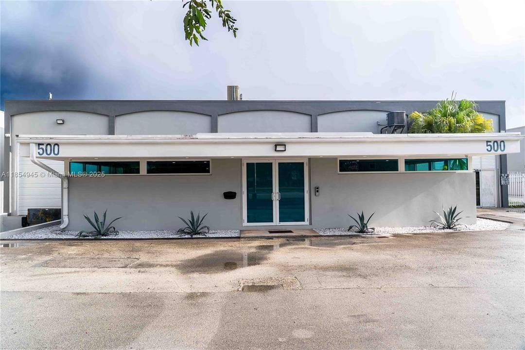 Fully remodeled office warehouse in Hialeah featuring updated offices, conference room, modern kitchen, and renovated bathrooms.