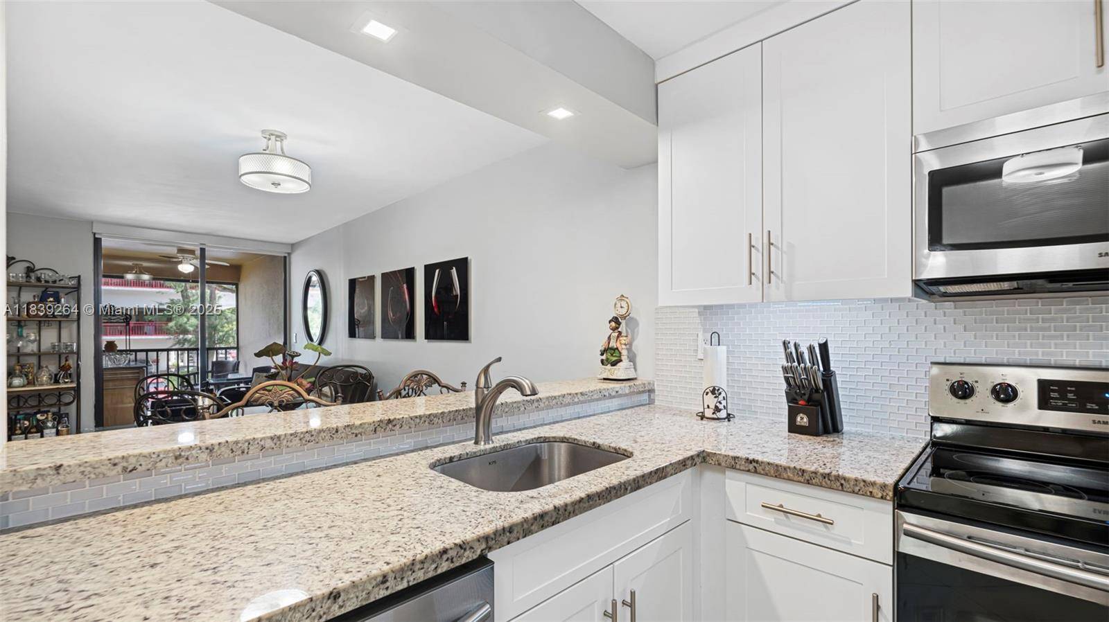 Nestled in the heart of Miami Lakes, this elegantly remodeled, turn key 2 bedroom, 1.