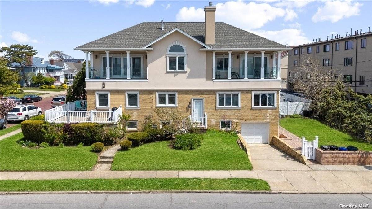 Step into the heart of Long Beach, where this exquisite Colonial awaits, mere steps from the ocean and boardwalk.