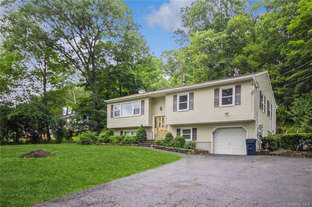 Welcome to 36 Woodbine Dr, a meticulously maintained raised ranch situated in the heart of Mahopac, NY.