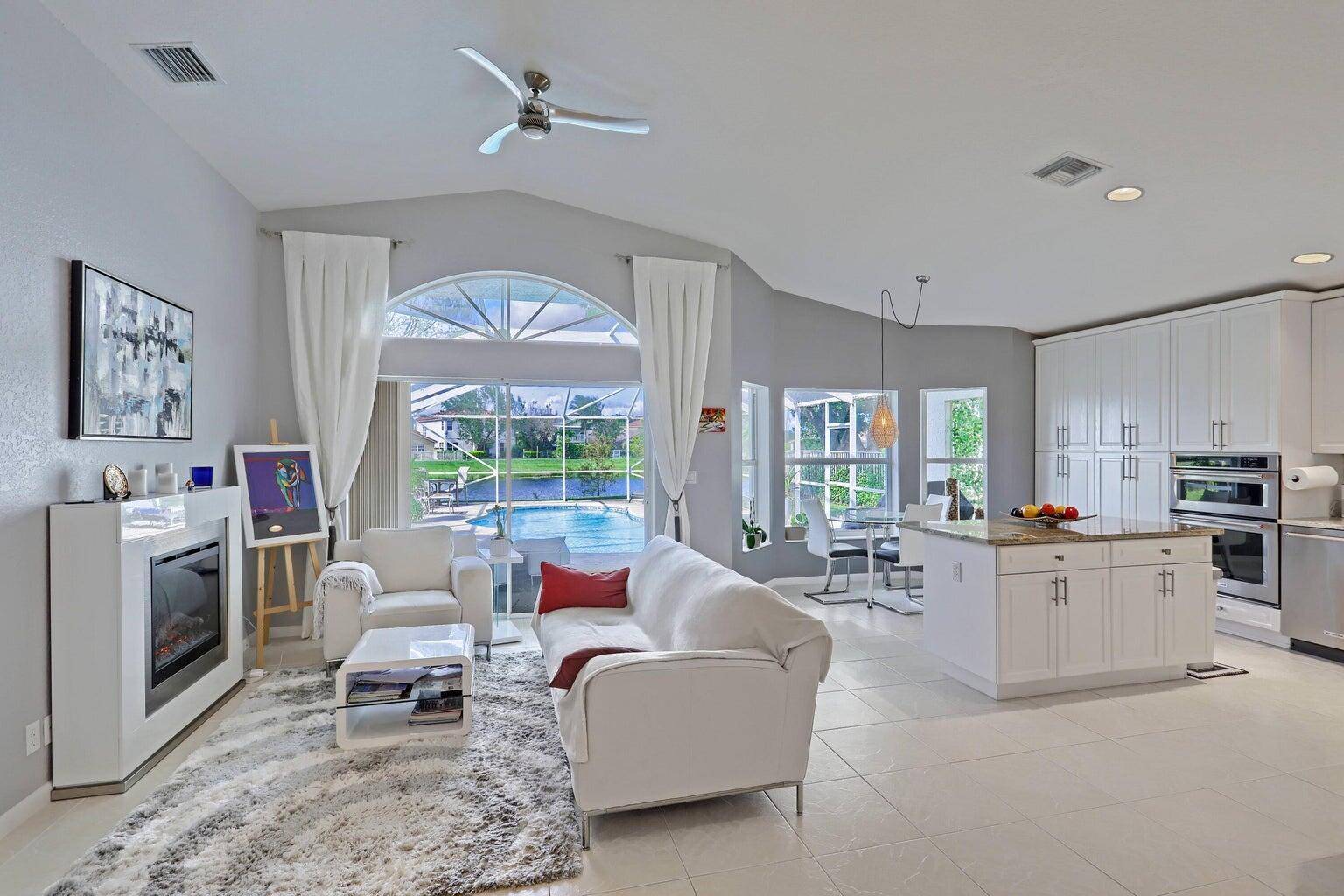 This amazing lake house is located in the desirable community of Lakefield on the Wanderers golf course.
