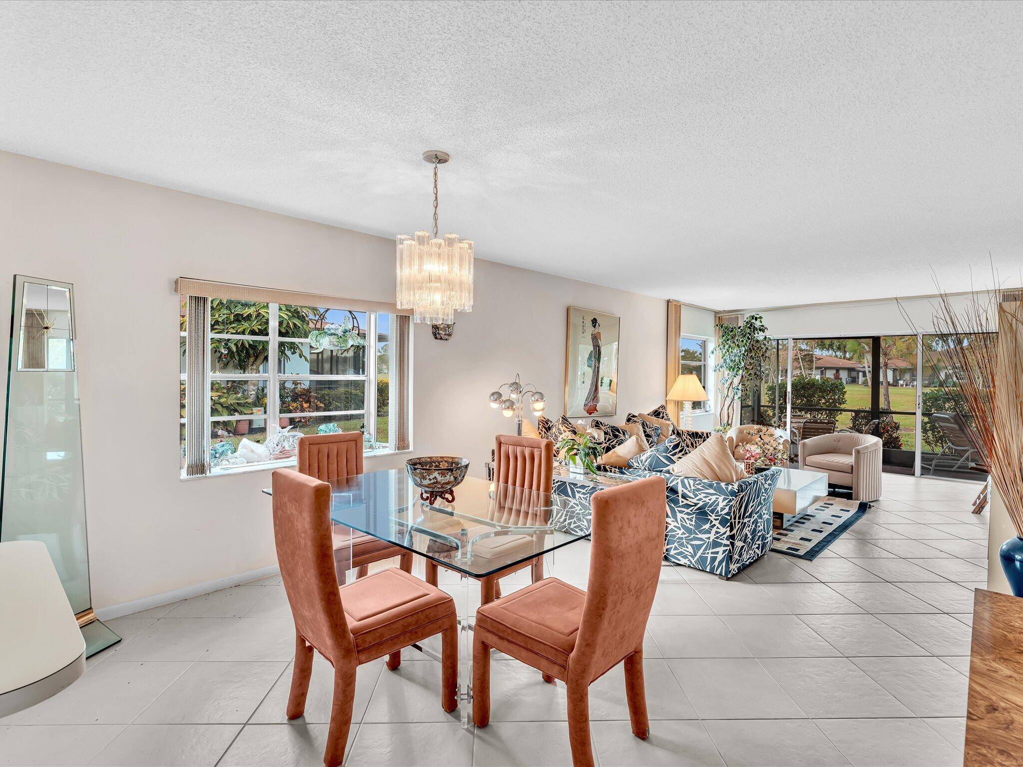 First floor corner with large screened patio full width of Living Room and Primary Sutie and fabulous park and lake view.