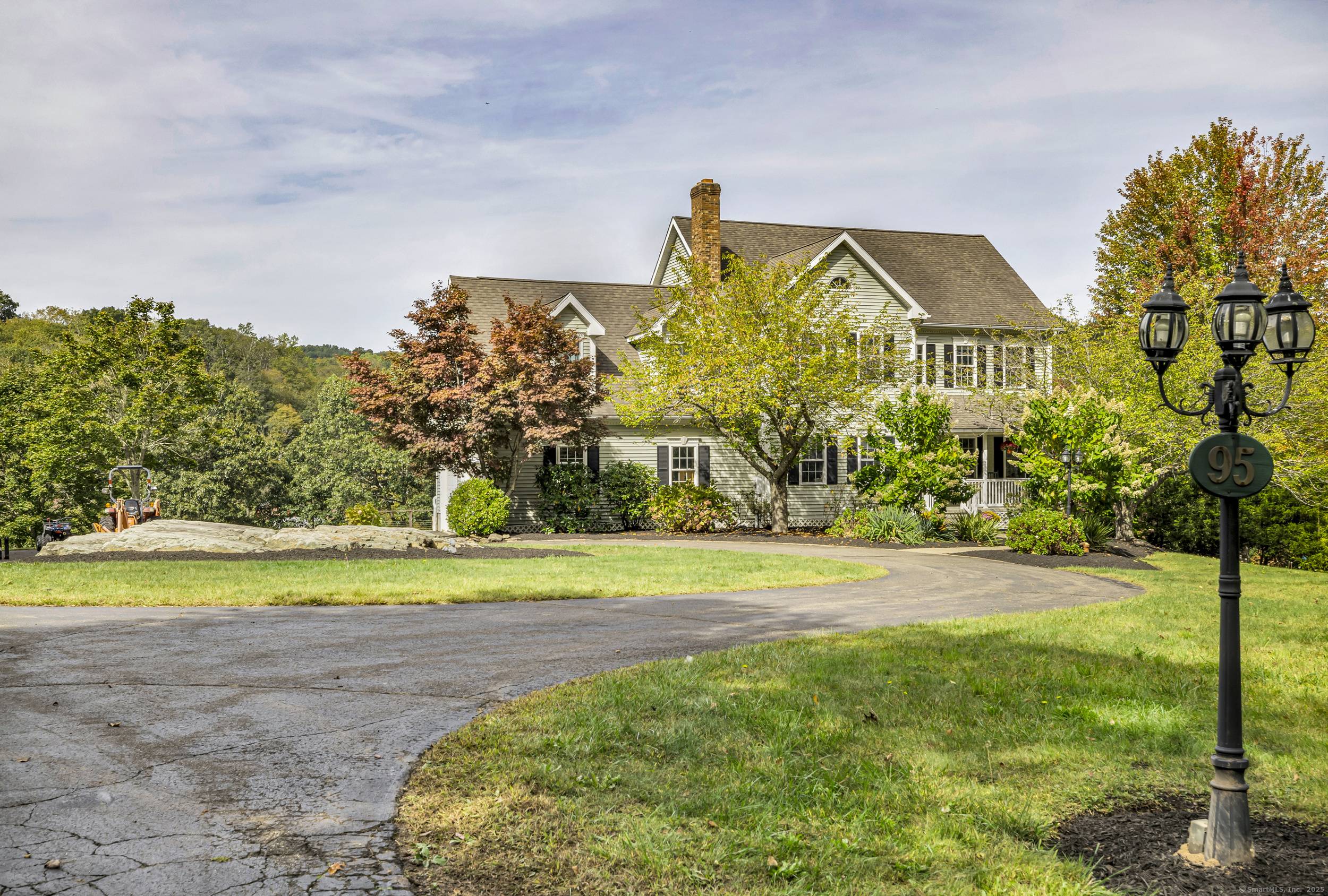 Nestled on a serene 2. 19 acre lot at the end of a cul de sac on a private road, this Colonial is flanked by similar homes, offering a peaceful ...