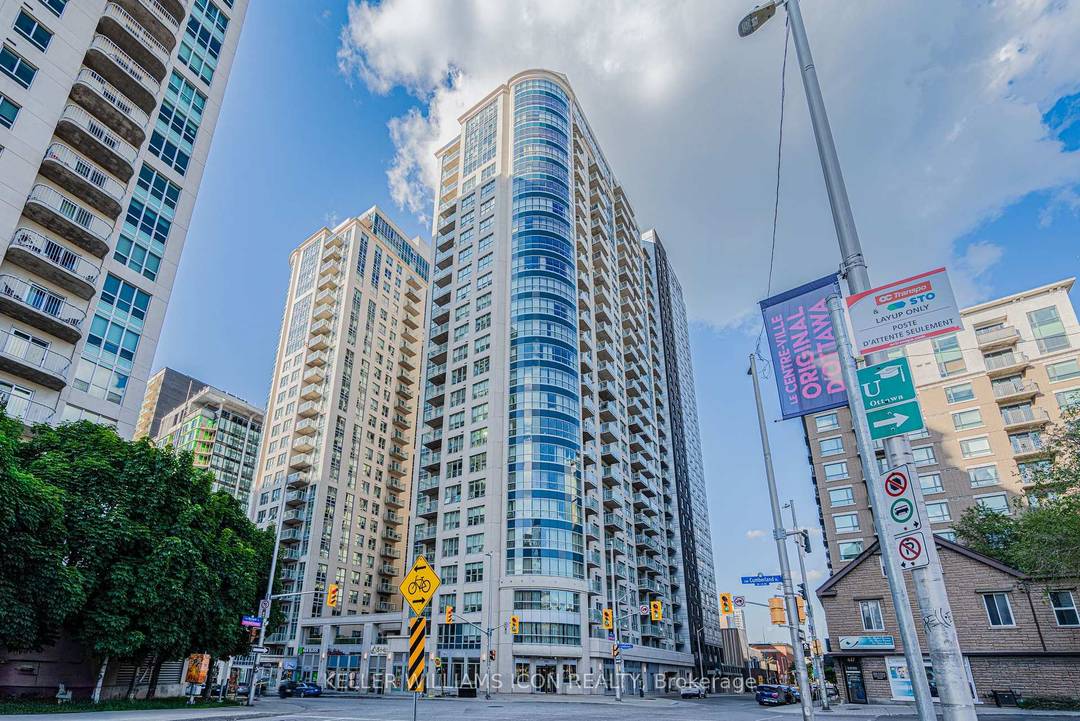 Oversized curved windows wrap the living space, delivering exceptional natural light and breathtaking panoramic views overlooking much of Ottawa, creating a truly distinctive urban living experience.