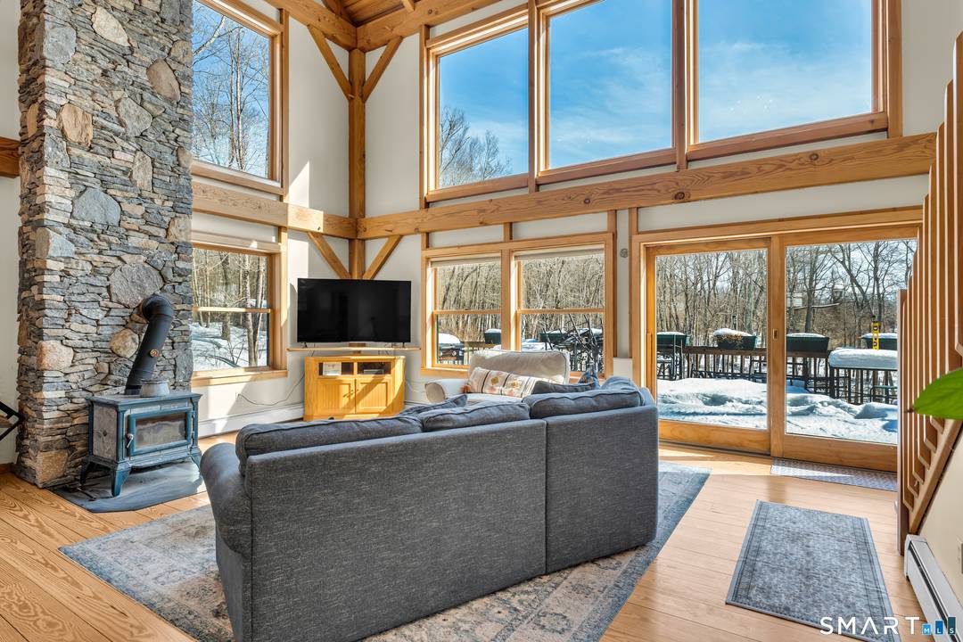 Beautifully landscaped, this custom built Post and Beam Contemporary sits on almost 2 acres and embodies the feeling of living in a vacation home.