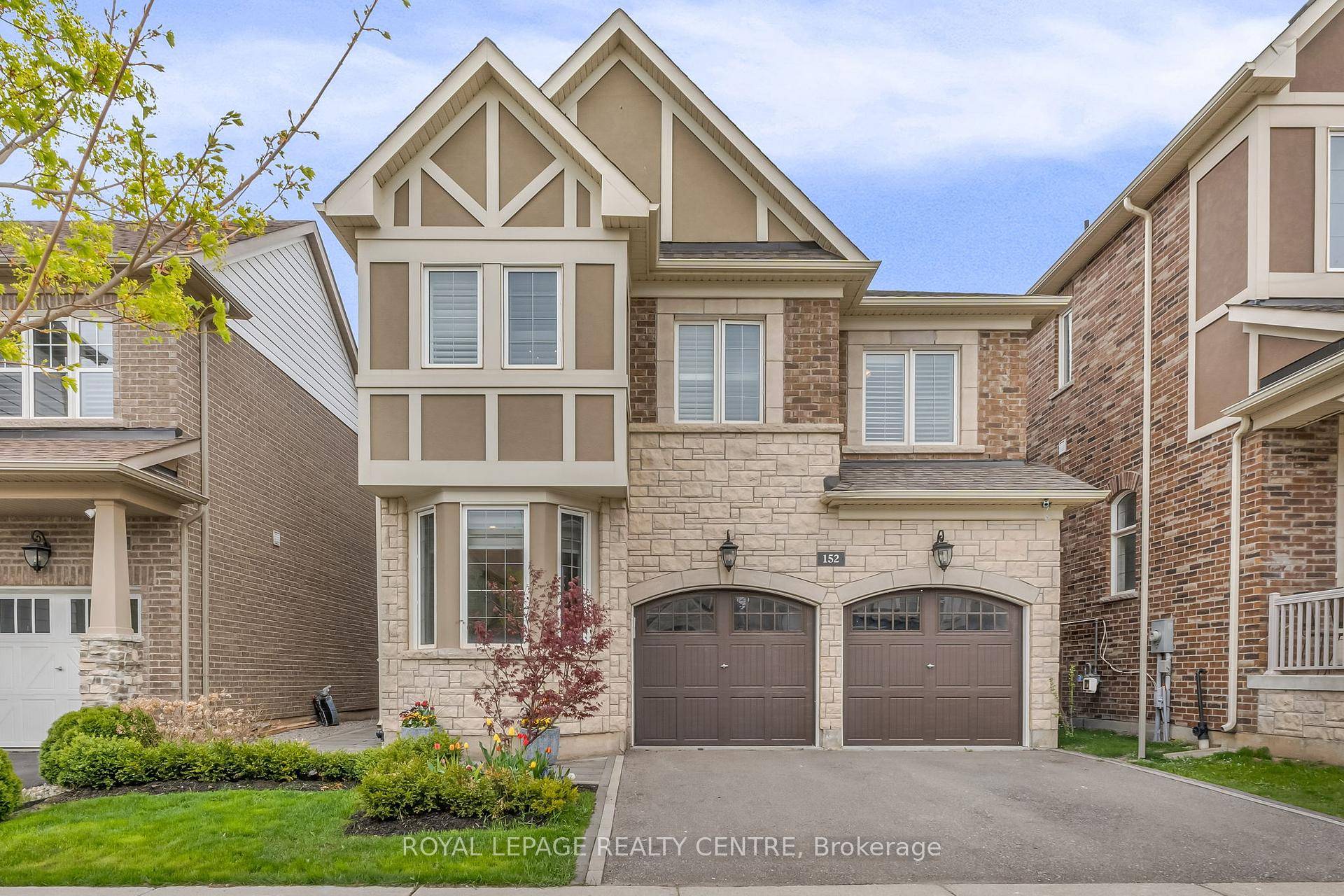 This Stunning Mattamy Built Home Features A Striking Modern Exterior, Enhanced By Contemporary Stonework In The Walkway And Backyard Patio.