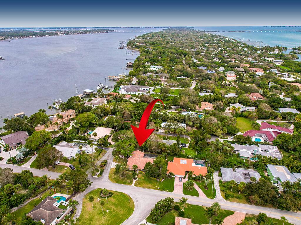 ''Sewall's Point Gem ! This stunning property sits on a large corner lot, offering both space and privacy.