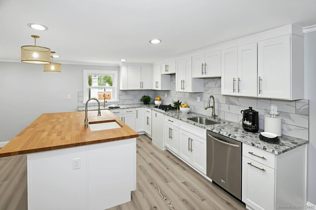 Welcome to this beautifully renovated Cape in the heart of Trumbull.