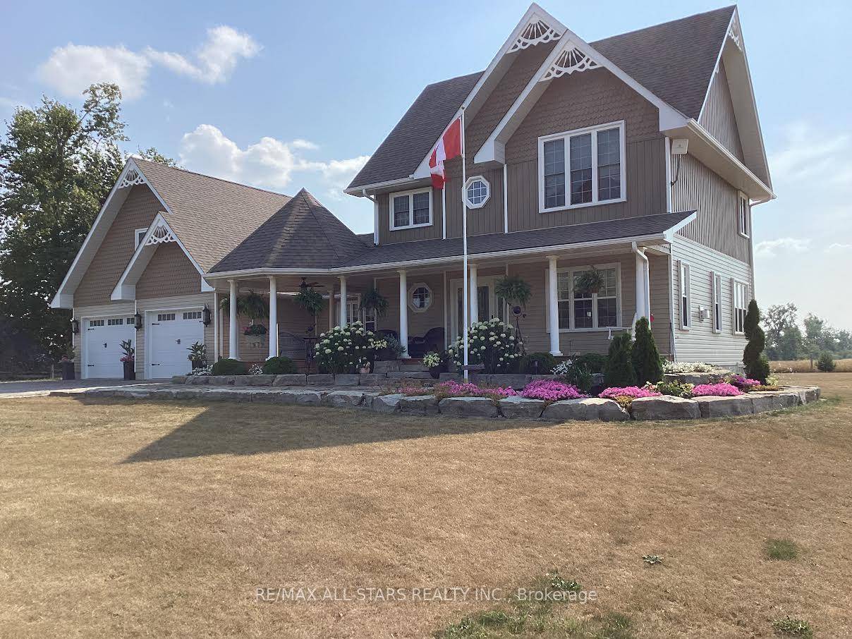 This custom built on a full sized acre lot offers country living at its best !