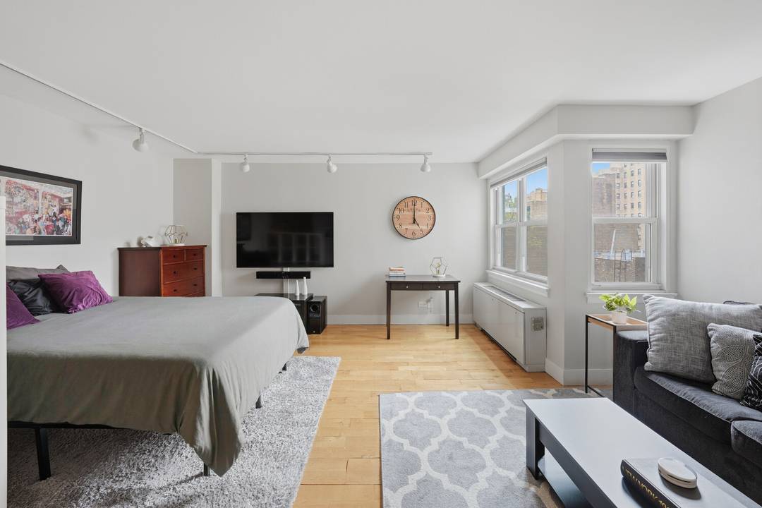 Chic Village Alcove Studio Bathed in soft northern and western light, this beautifully renovated alcove studio at 101 West 12th Street captures the effortless charm of Greenwich Village living.