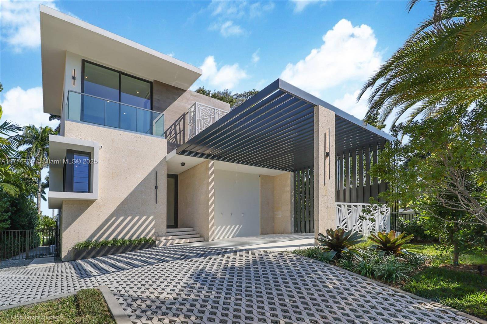 Prime turnkey residence nestled directly in front of the prestigious La Gorce Country Club golf course.