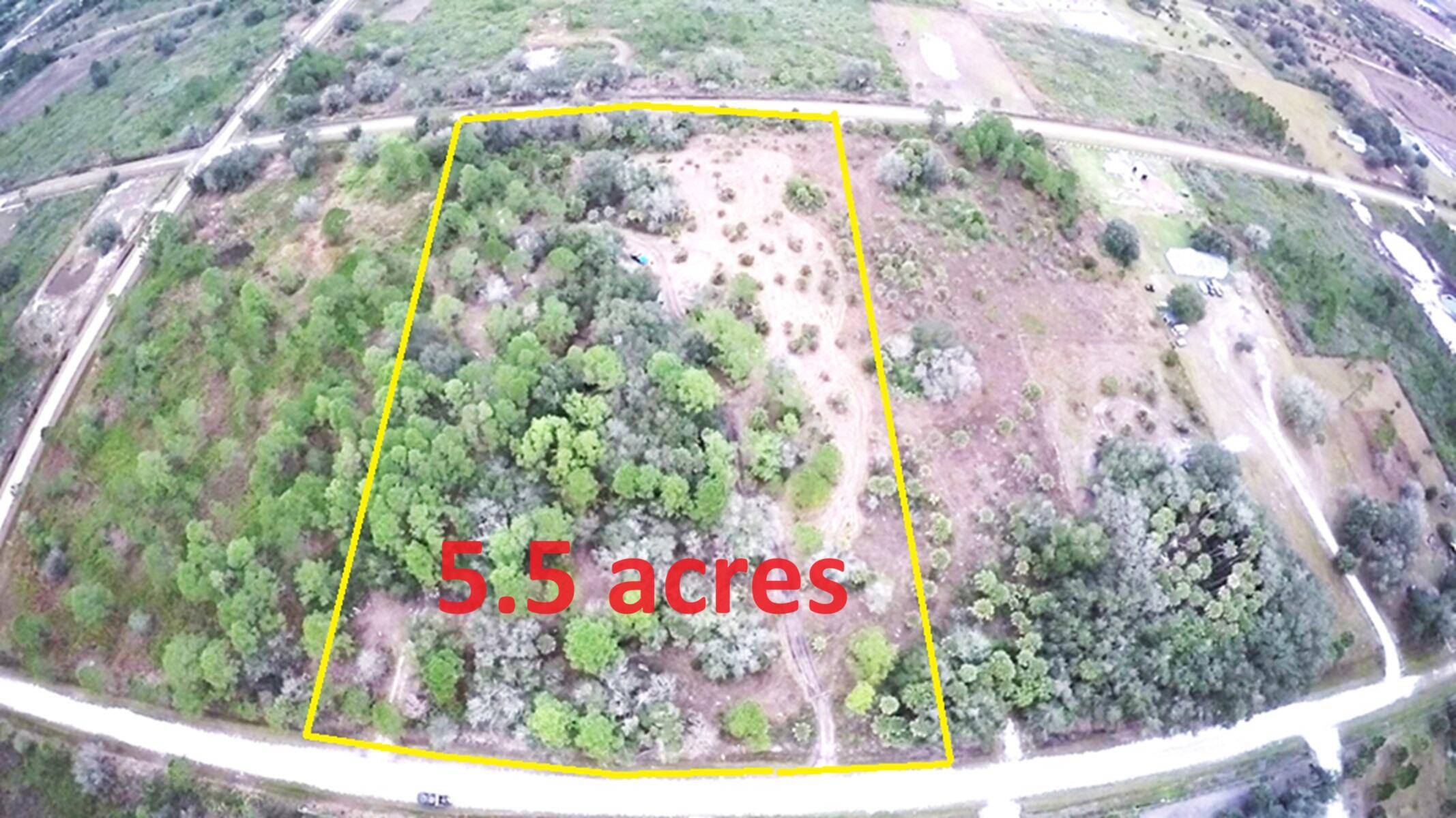 5. 5 acres vacant land with improvements.