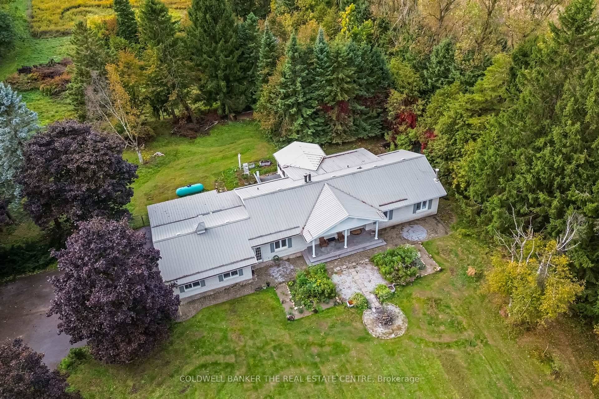 Rustic Charm Meets Modern Comfort Nestled on 34 peaceful Acres !
