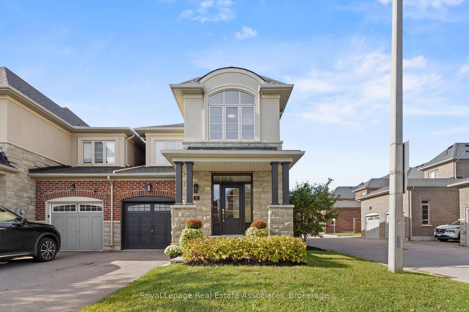 Welcome to 8 Sierra Crescent a stunning end unit townhome that feels just like a semi, only attached at the garage !