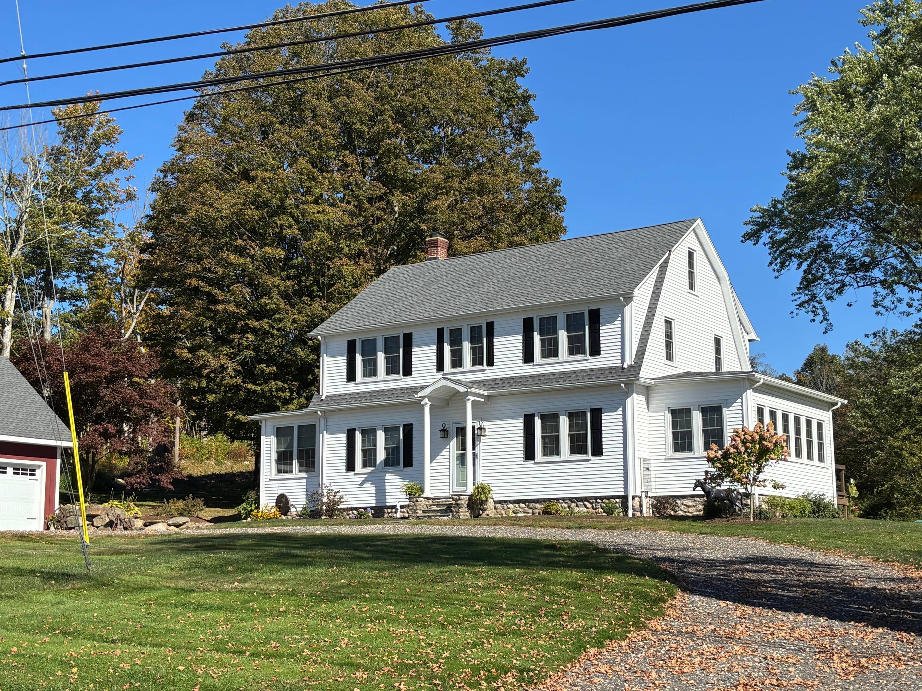Truly a one of a kind property, this timeless 1929 New England home has been thoughtfully remodeled just three years ago, blending classic character with modern comfort.