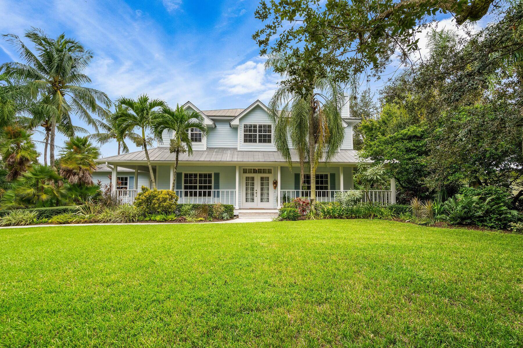 Stunning Lakefront Property with Key West Style Home and Adjacent Lot.