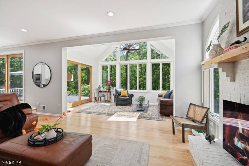 Welcome to this beautifully upgraded 4 bedroom brick front Colonial, set on 5.