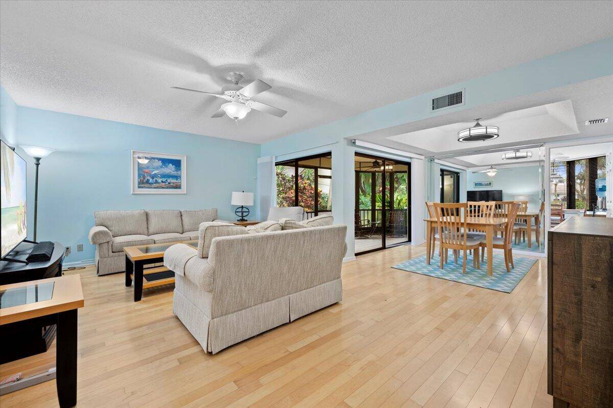 Welcome to your dream home at 16942 Waterbend Drive, Unit 155, nestled in the beautiful golf course community of Jonathan's Landing in Jupiter, FL !