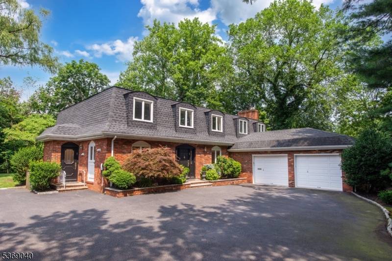 A Must See ! Welcome to this spacious Mansard Colonial tucked away on a private.
